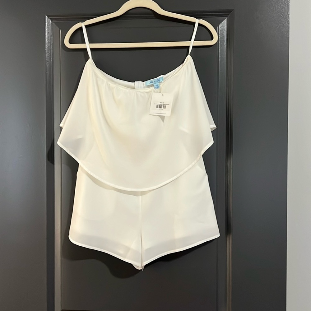 Size small, she + sky, white romper; never worn. New with tags